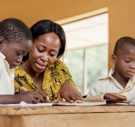 teacher-helping-kids-class